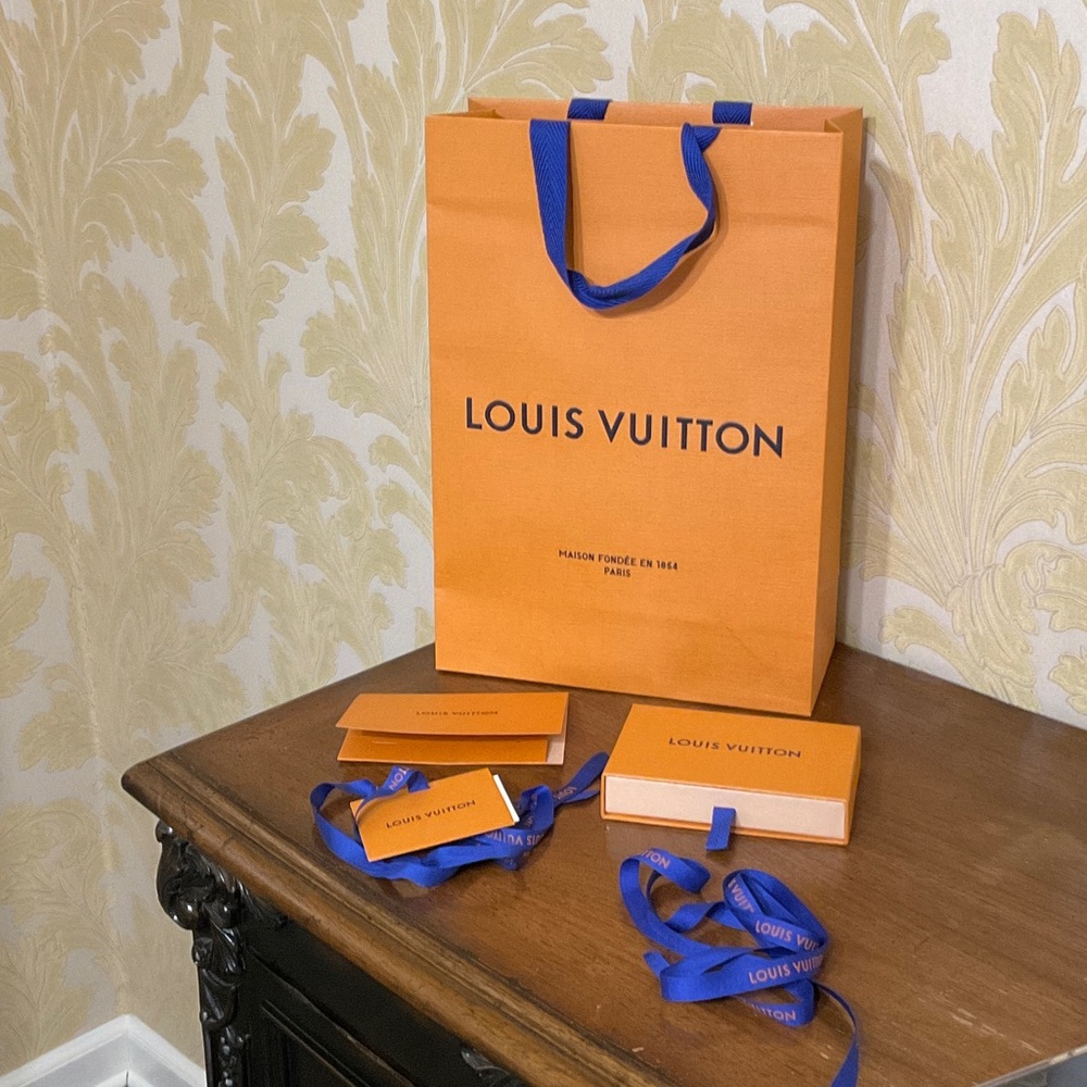 Louis Vuitton shopping bag, box, gift card and tag, receipt holder and ribbon.